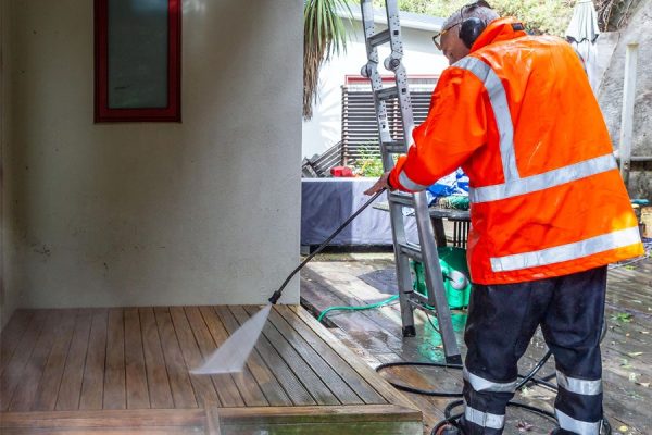 Acorn House Washing a deck in the Wellington region.